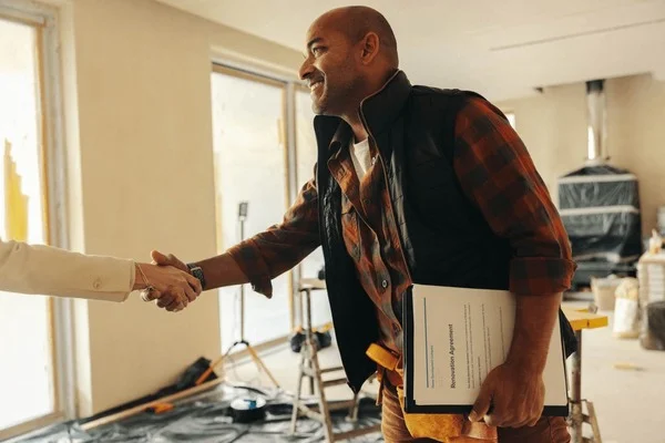 Service business professional reviewing work with a customer